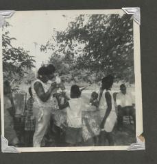 People at an outdoor birthday celebration