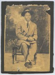 Young man in a large suit