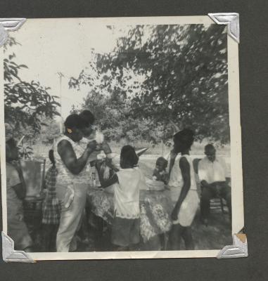 People at an outdoor birthday celebration