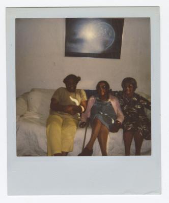 Three older women on a couch