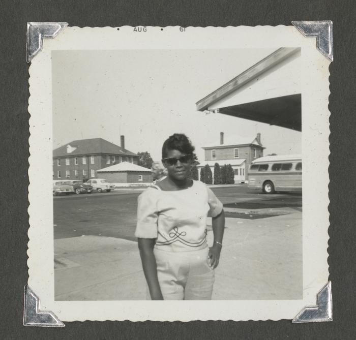 A woman posing outside