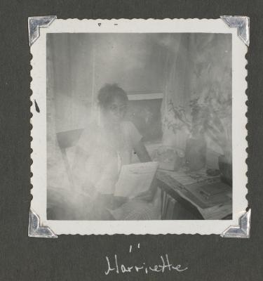 Harriette reading by a window