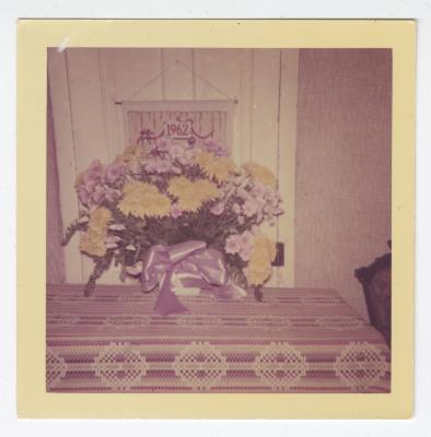 Purple and yellow flowers on a table