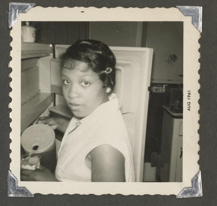 A woman pouring iced tea