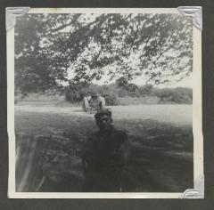 An older man sitting outside