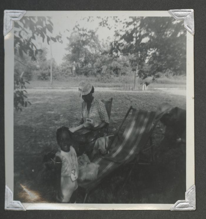 Two adults and a child outside