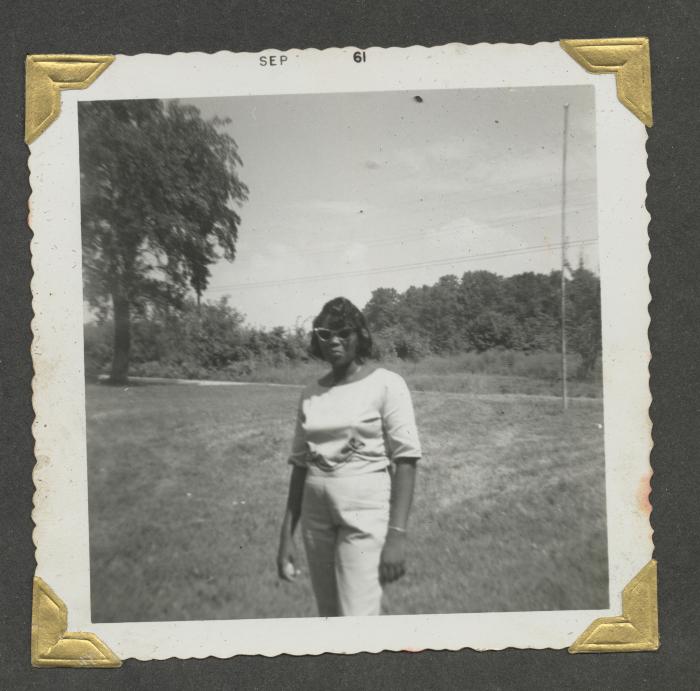 A woman in a white shirt and pants 