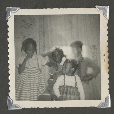 Four young girls standing together