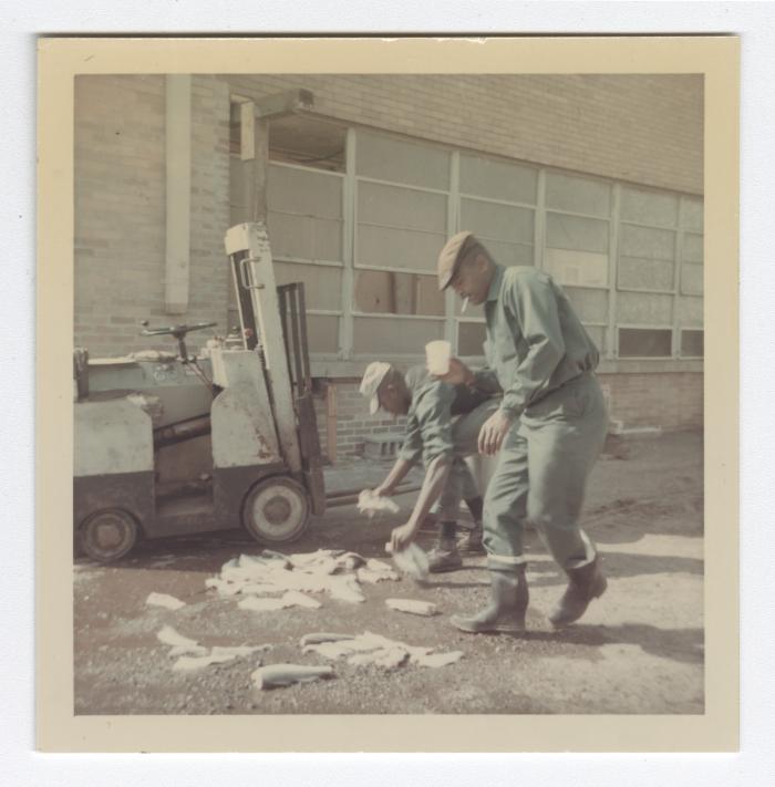 Harold Sisco and Joshua "Berkie" Fenwick pick up fish at VITA Foods