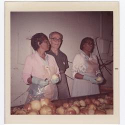 Sorting through yellow onions at VITA Foods