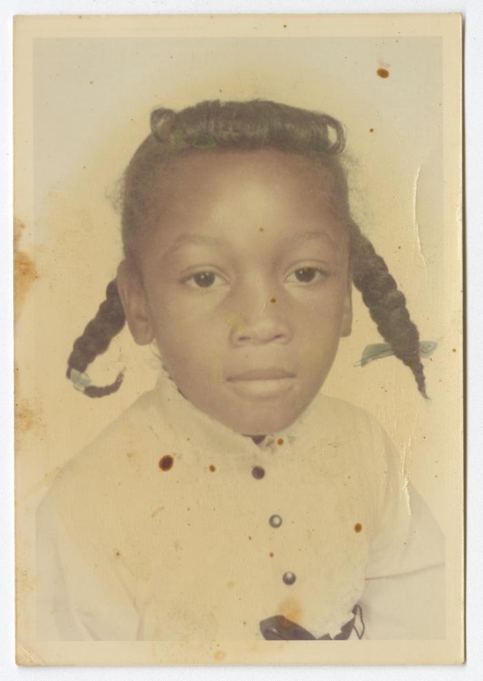 Portrait of a young girl in pigtails