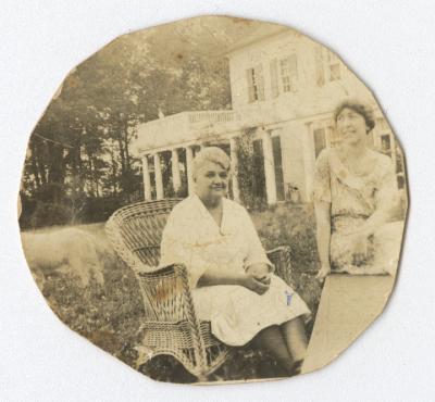 Two women sitting in a garden