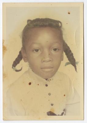 Portrait of a young girl in pigtails