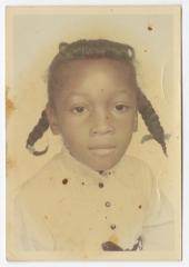 Portrait of a young girl in pigtails