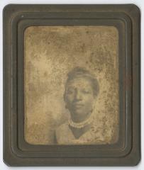 Framed photograph of a woman in pearls