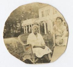 Two women sitting in a garden