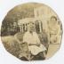Two women sitting in a garden