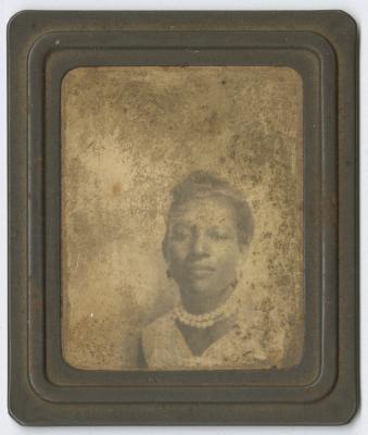 Framed photograph of a woman in pearls