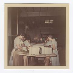 Women employees sorting through pickles at VITA Foods