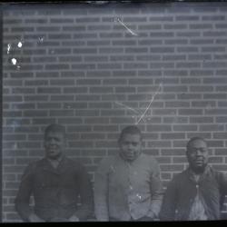 Three unidentified young African American men at the Kent County Jail