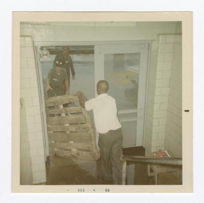 Carrying a wooden pallet, 1969 August