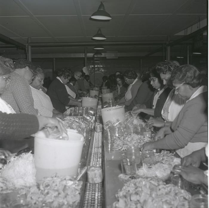 Women working on the packing line at the Vita Foods plant.
