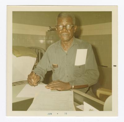 Richard Henry Ford completing VITA Foods paperwork just before his retirement from the plant, 1970