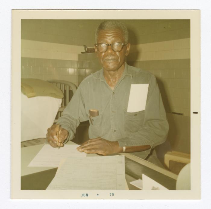 Richard Henry Ford completing VITA Foods paperwork just before his retirement from the plant, 1970