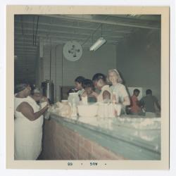 Mrs. D. Tasch, Donna Thompson, Sharon Elias, Renae Cann and Vanessa Lomax visit the food counter at Vita Foods
