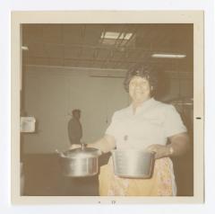 Carrie Wilson preparing Christmas dinner at Vita Foods, 12-3-1971