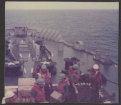 Crew aboard a naval vessel