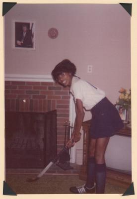 Young woman in field hockey uniform