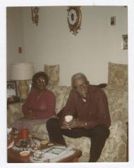 Man and woman sitting on couch