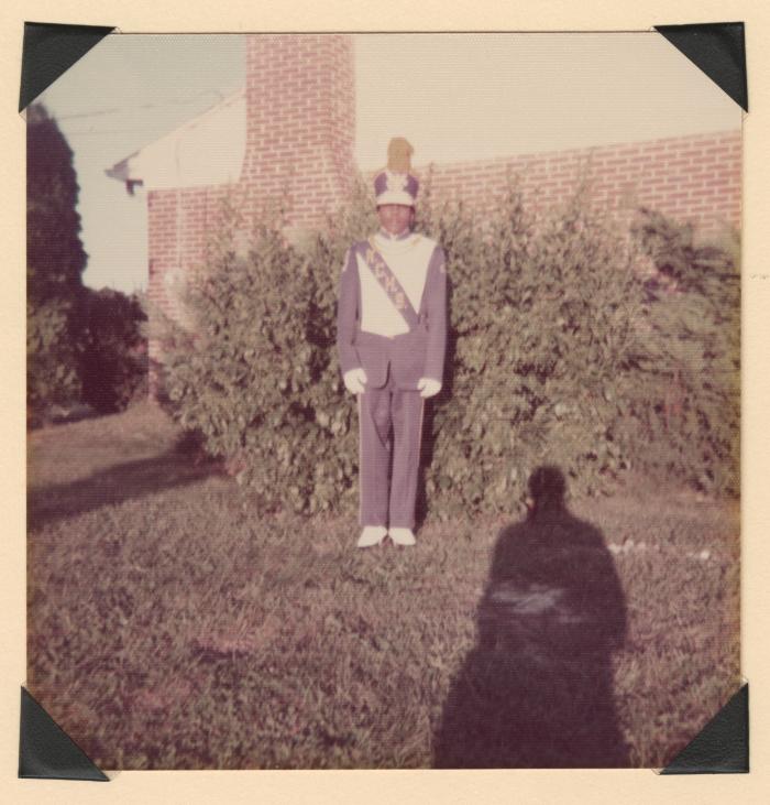 Young man in marching band uniform