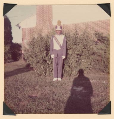 Young man in marching band uniform