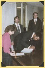 Man signing document