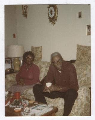 Man and woman sitting on couch