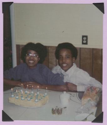 Girl and boy with birthday cake