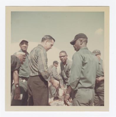 Men chatting at the Annual VITA Foods Cookout