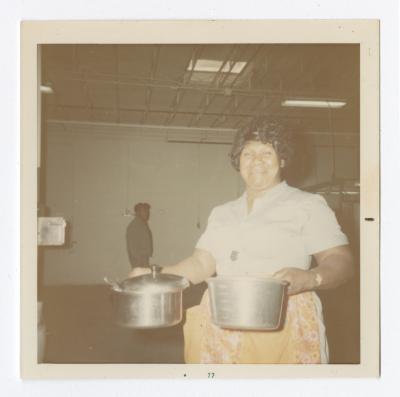 Carrie Wilson preparing Christmas dinner at Vita Foods, 12-3-1971