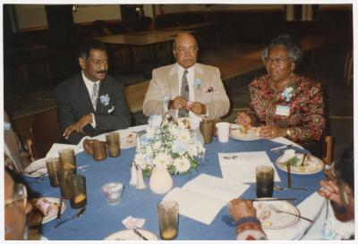 Attendees at their table at Garnett High School's 9th All School Class Reunion