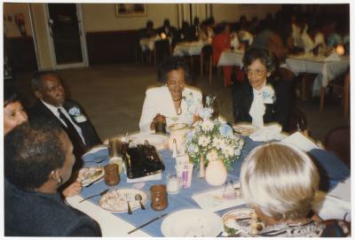 Attendees sitting at Garnett High School's 9th All School Class Reunion