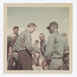 Men chatting at the Annual VITA Foods Cookout