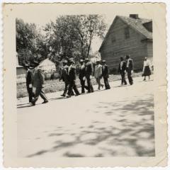 Men marching in a procession 