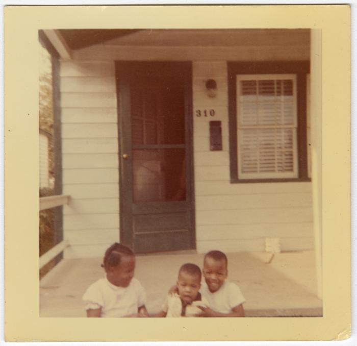 Deaton children sitting on the front steps
