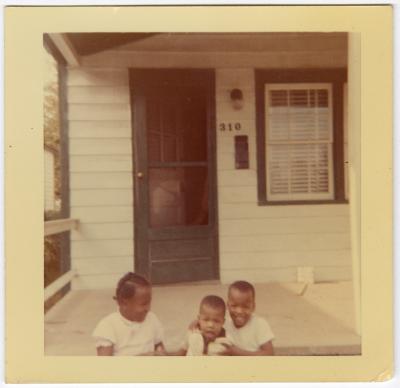 Deaton children sitting on the front steps
