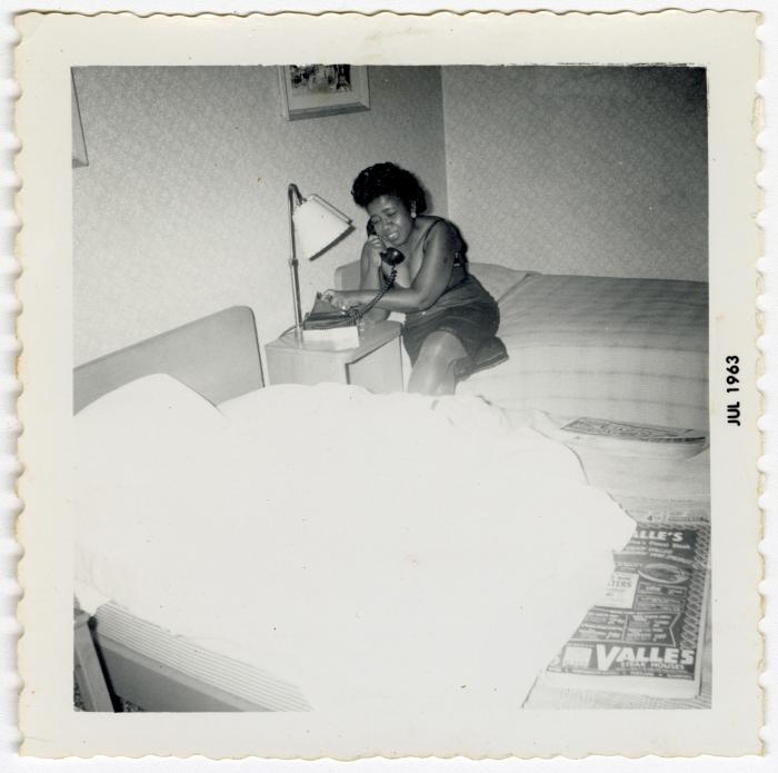 Fannie Wilson talking on a hotel phone