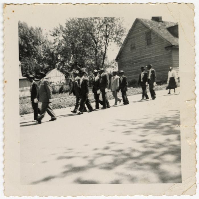 Men marching in a procession 