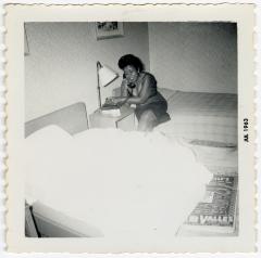 Fannie Wilson talking on a hotel phone