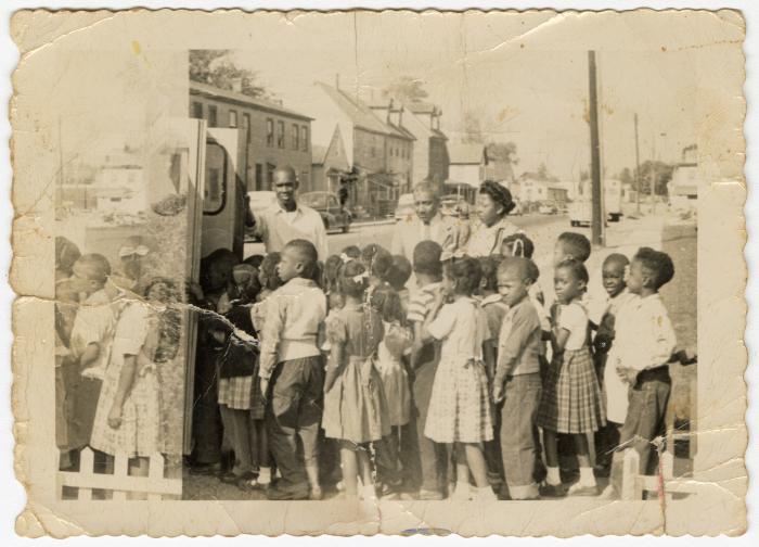 Students getting on a bus
